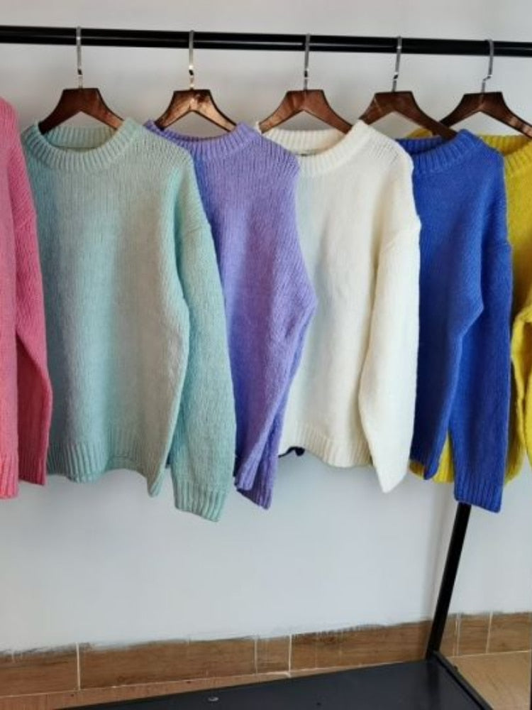 A Collection of Womens Wool and Acrylic Puff Sleeve Jumpers in Pink, light green, light purple, white, blue and yellow